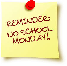 A yellow sticky note with red text that reads, "Reminder: No school Monday!" pinned with a red thumbtack.